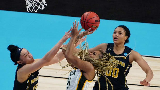 Mar 27, 2021; San Antonio, Texas, USA; Baylor Lady Bears guard DiJonai Carrington (21) tries to shoot between Michigan Wolverines forward Hailey Brown (15) and forward Naz Hillmon (00) during overtime in the Sweet Sixteen of the 2021 Women's NCAA Tournament at Alamodome. Mandatory Credit: Kirby Lee-USA TODAY Sports